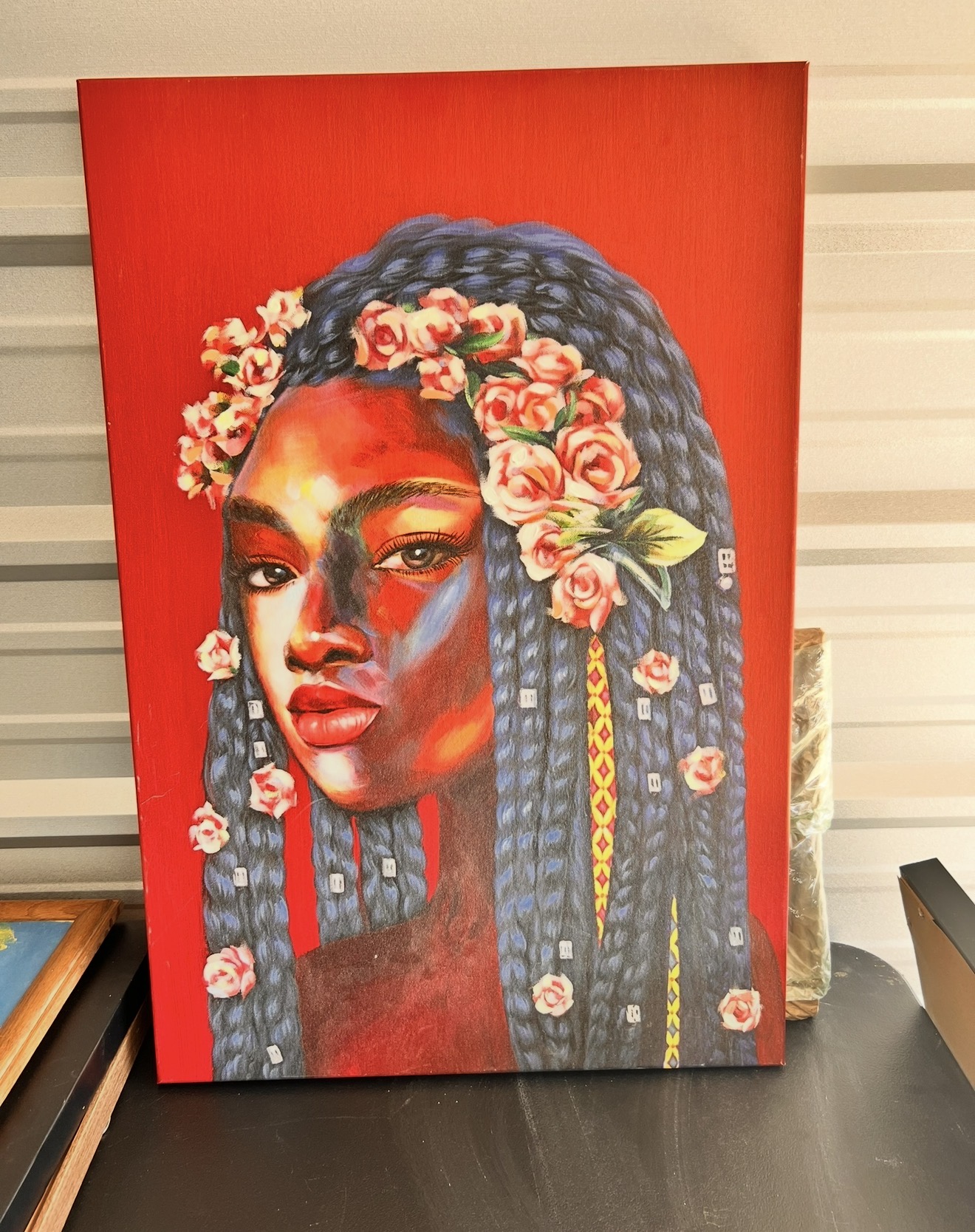 Beautiful painting of woman with brown and red skin tones, long braids with flower crown. additional image